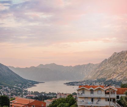 Sunset, beautiful landscape with silhouettes of trees. Travel concept. Montenegro, Kotor Bay. Sunset at Kotor Bay Montenegro. View of the sunset in Boko-Kotor Bay in Montenegro.