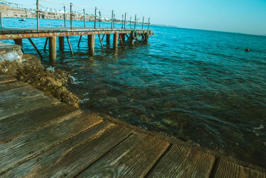 wooden pier in the sea with waves. High quality photo