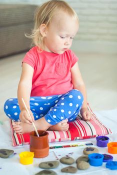 toddler paints with gouache. High quality photo