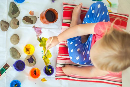 toddler paints with gouache. High quality photo