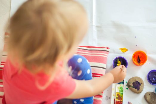 toddler paints with gouache. High quality photo