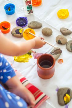 toddler paints with gouache. High quality photo