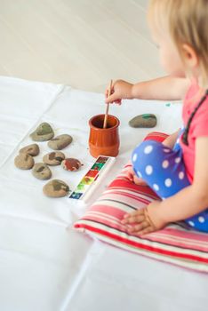 toddler paints with gouache. High quality photo