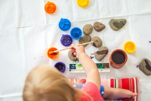 toddler paints with gouache. High quality photo