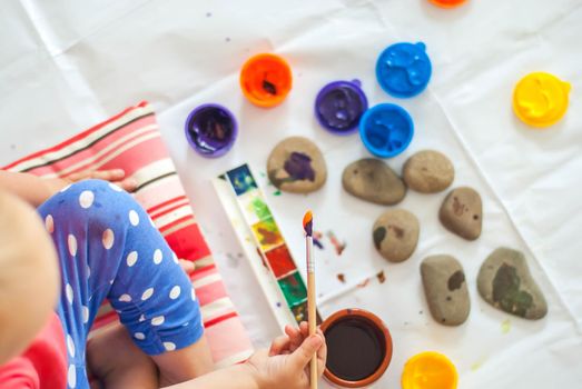 toddler paints with gouache. High quality photo