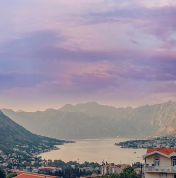 Sunset, beautiful landscape with silhouettes of trees. Travel concept. Montenegro, Kotor Bay. Sunset at Kotor Bay Montenegro. View of the sunset in Boko-Kotor Bay in Montenegro.