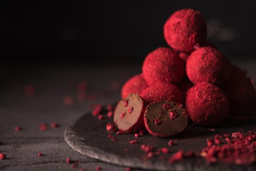 chocolate truffle with raspberry powder.dark mood photo