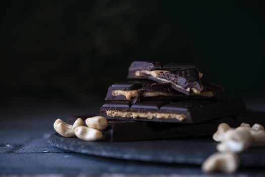 home made chocolate with cashew cream fillings. dark food photo