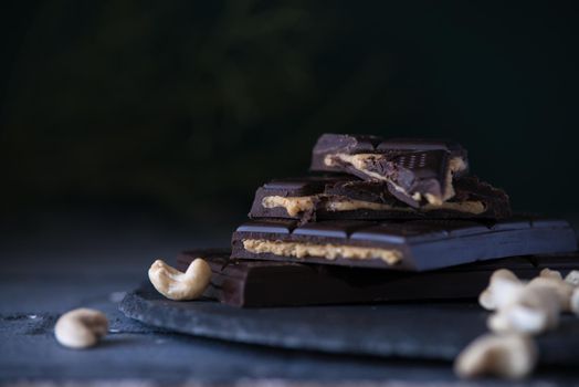 home made chocolate with cashew cream fillings. dark food photo