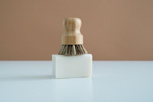 zero waste bamboo brush with soap for dishwashing . High quality photo