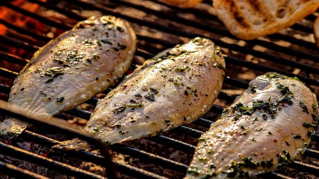 Tasty Grilled sole food detail with smoke