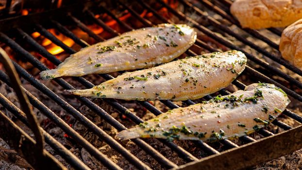 Tasty Grilled sole food detail with smoke