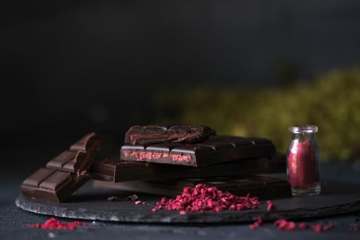 dark homemade chocolate with raspberry filling. dark mood photo