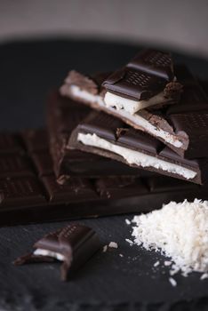 chocolate homemade bars with coconut fillings. dark food photo