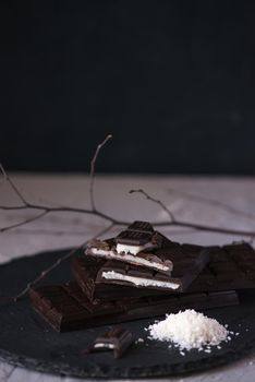 chocolate homemade bars with coconut fillings. dark food photo