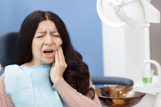 Toothache! Senior woman having a terrible toothache visiting dentist copyspace pain hurting cavities dentistry dental issues problems health suffering unhealthy aging elderly patient help concept