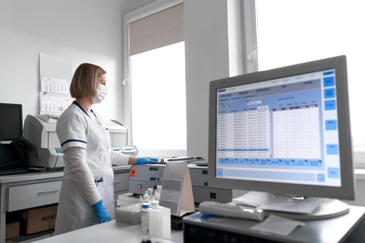 Female relaxed doctor working in an hospital office