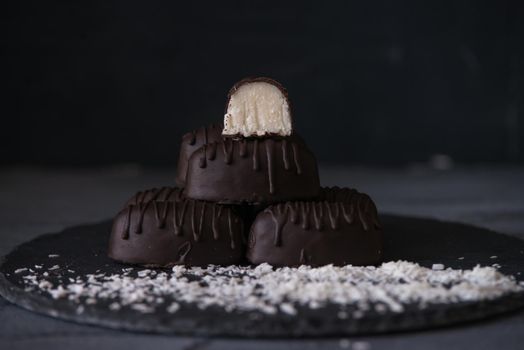 chocolate homemade bounty with coconut fillings.dark food photo