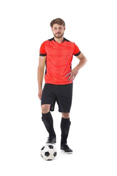Full length portrait of a soccer player with ball isolated on white background