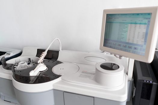 Centrifuge machine and a computer in a hospital room