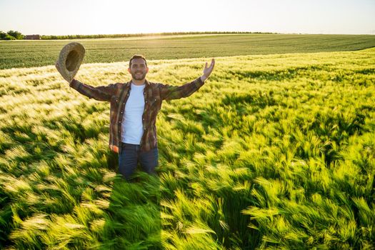 Farmer is cultivating barley. He is satisfied because of good season.