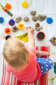 toddler paints with gouache. High quality photo