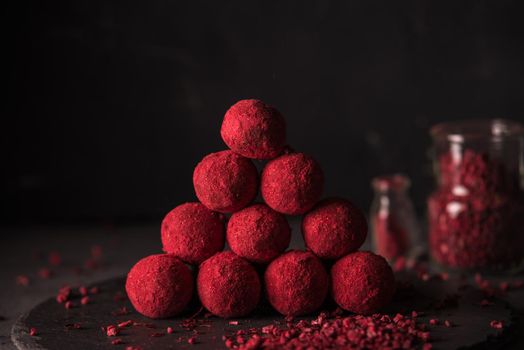 chocolate truffle with raspberry powder.dark mood photo