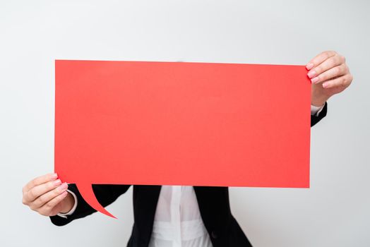 Businesswoman Holding Speech Bubble With Important Messages.