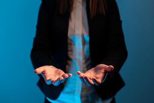 Businesswoman In Suit Holding Important Informations Over Hands.