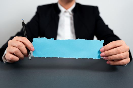 Businesswoman Holding Note With Important Message On Office Desk.