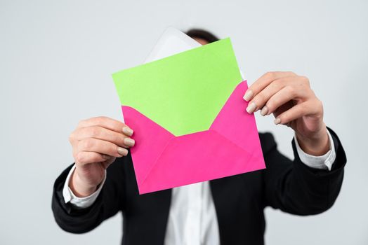 Businesswoman Holding Envelope With Important And Crucial Memorandum.