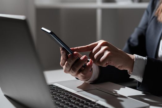 Woman Holding Tablet In One Hand And Pointing On News With One Finger.