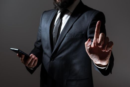 Man Holding Tablet And Pointing With One Finger On Important Message.