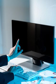 Businesswoman Pointing Important Infortmation With One Finger On Computer.