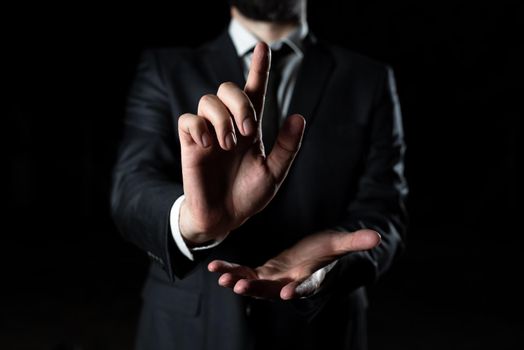 Man Pointing Ideas With One Finger And Presenting News With Other Hand.