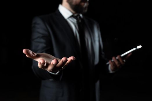 Businessman Holding Phone In One Hand In Other Important Message.