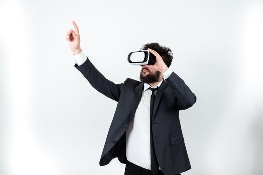 Man Wearing Vr Glasses And Pointing On Important Messages With One Finger.