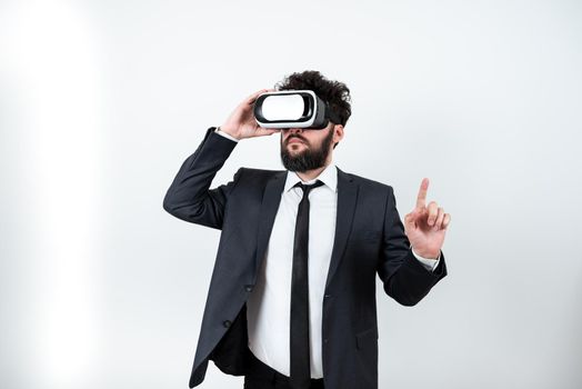 Man Wearing Vr Glasses And Pointing On Important Messages With One Finger.