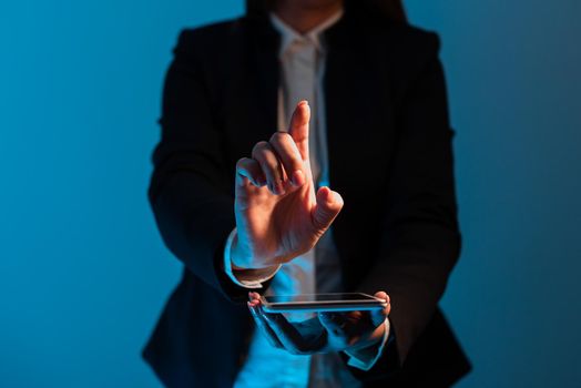 Businesswoman Holding Tablet And Pointing With One Finger On Important News