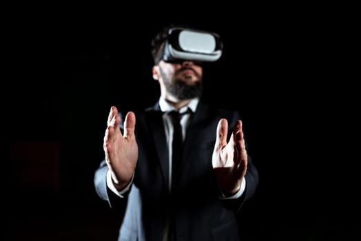 Businessman Wearing Suit Gesturing And Wearing Virtual Reality Simulator.