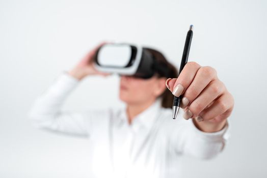 Woman Wearing Vr Glasses And Pointing On Recent Updates With Pen.