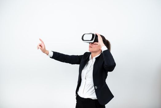 Woman Wearing Vr Glasses And Pointing On Important Message With One Finger.