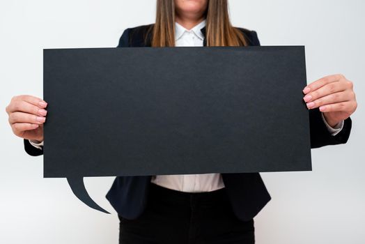 Businesswoman Holding Speech Bubble With Important Messages.