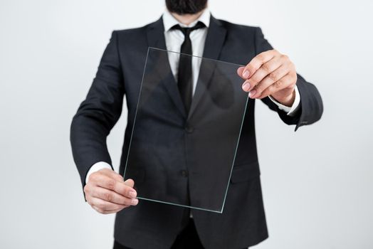 Businessman Holding Transparent Glass And Promoting The Company Brand.