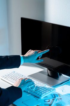 Businesswoman Pointing Important Infortmation With One Finger On Computer.