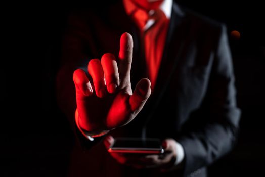 Man Holding Tablet And Pointing With One Finger On Important Message