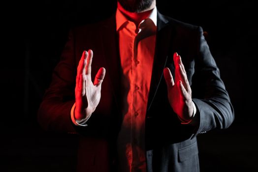 Businessman Presenting Important Informations Between Hands.