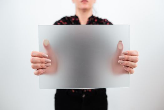 Woman Showing Placard With New Strategies For Business Marketing.