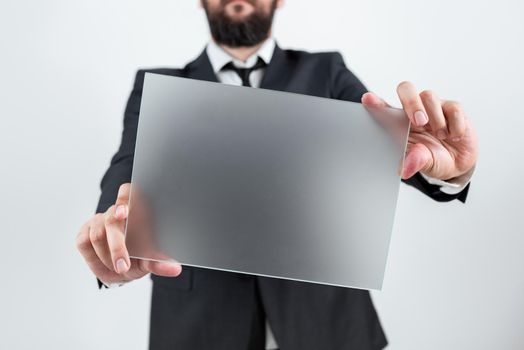 Male Professional Showing Placard And Advertising The Company.