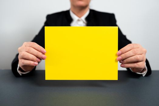 Businesswoman Holding Note With Important Message On Office Desk.